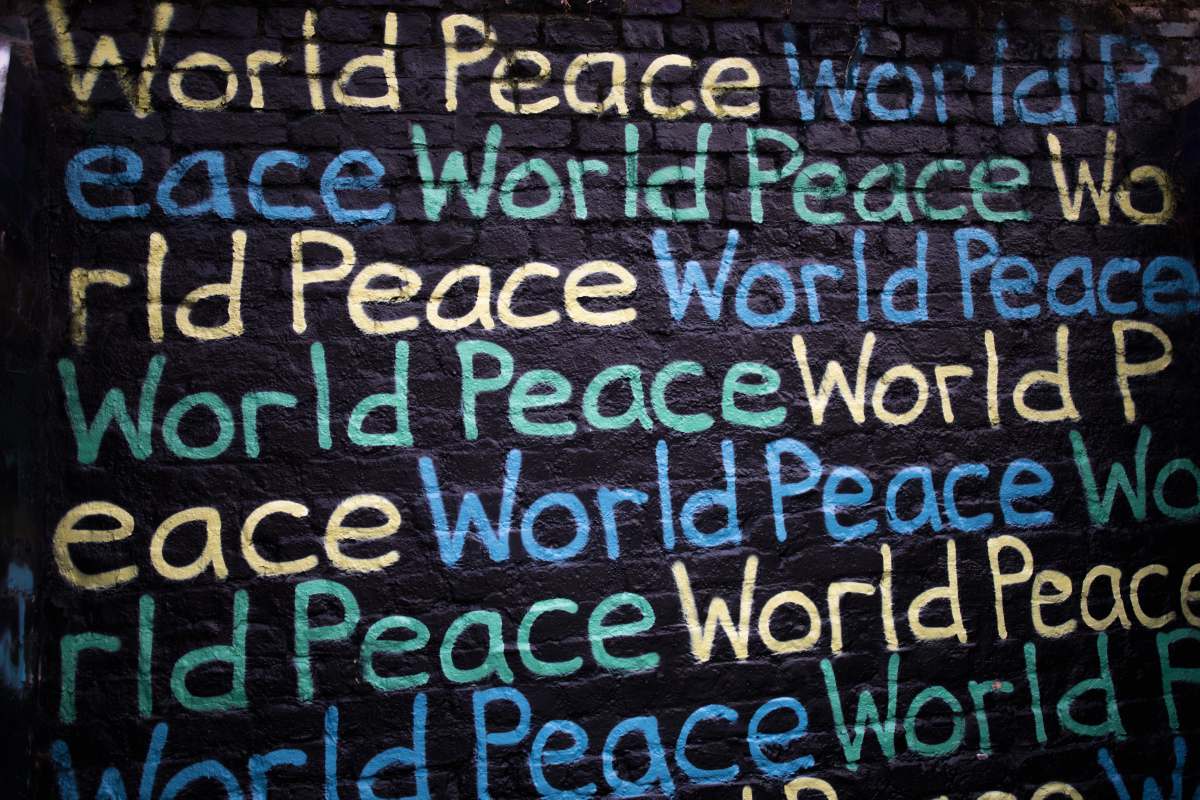 united kingdom World Peace text printed on wall world peace